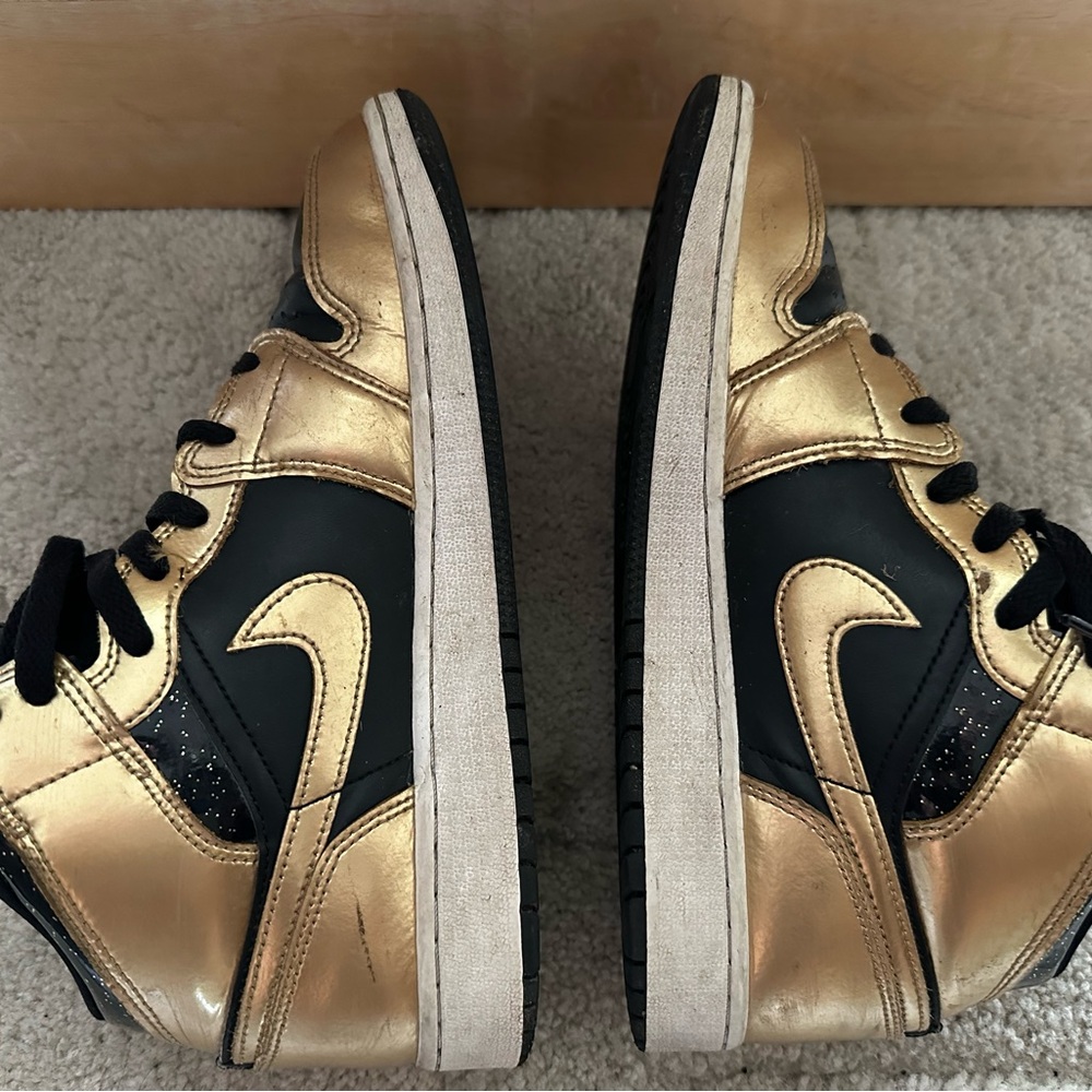 Nike Jordan Black and Gold High-Top Sneakers